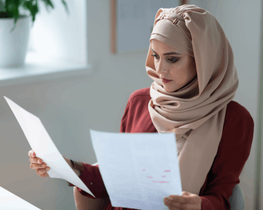 A certified linguist checks Arabic and English text on screen as Arabic Translation Services in Illinois handles legal docs.