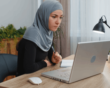 A translator stamps a certified Arabic contract, showing Arabic Translation Services in Illinois for accurate certification.