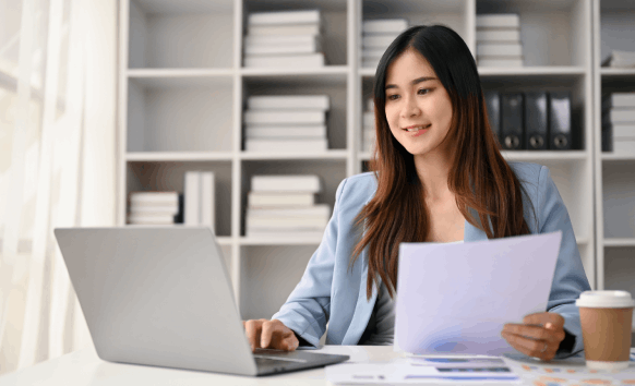 A linguist reviews a certified website translation on a laptop, demonstrating Translation Services in Chicago for accurate.