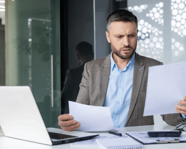 A translator manages a certified business glossary and terminology list on screen, delivering Translation Services in Cicero.