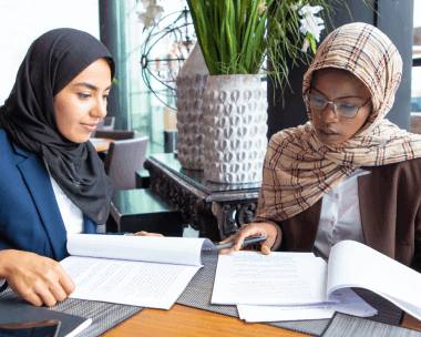 At an office desk, a specialist reviews forms and certificates for Arabic Translation Services in Illinois.