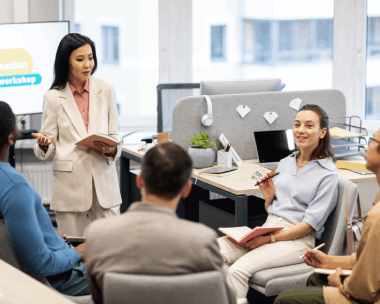 An expert translation team discusses terminology choices in a meeting, highlighting Chinese Translation Services in Illinois.