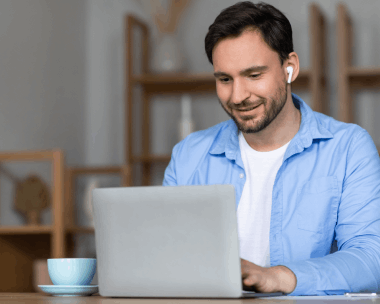 A native linguist edits a Spanish to English file on a laptop, delivering Translation Services in Chicago by expert.