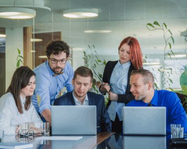 A bilingual team approves a certified marketing brochure with Spanish Translation Services in Illinois for consistency.