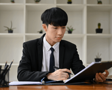 A certified translator prepares USCIS-ready forms and stamps a packet, using Chinese Translation Services in Illinois.