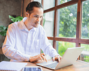 An engineer reviews a bilingual technical manual, showing Chinese Translation Services in Illinois for technical.