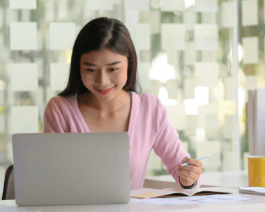 A linguist compares Chinese and Spanish text side by side, showcasing language pairs in Chinese Translation Services.