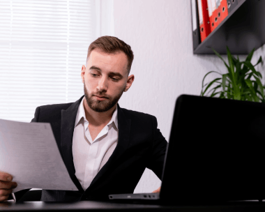 A translator checks a contract for Spanish Translation Services in Illinois, preparing a certified legal document set.