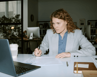 A translator checks a bilingual business contract for accuracy, using Polish Translation Services in Illinois for reliable.