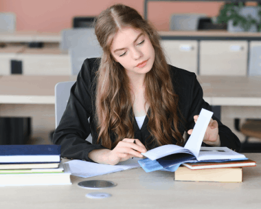 A student reviews a thesis draft with a translator, using Polish Translation Services in Illinois for accurate academic.