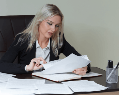 A professional project manager tracks Polish and English files on a screen, coordinating Polish Translation Services.