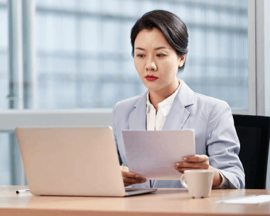 A translator prepares certified USCIS forms at a desk, showing Translation Services in Cicero for an on-time USCIS.