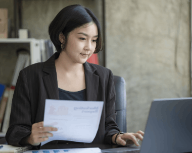 A translator marks up an equipment manual, providing Translation Services in Skokie for technical document translation.