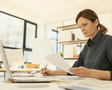 A student scans Spanish university transcripts for admission, relying on Translation Services in Skokie for academic.
