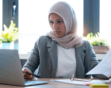 A translator checks Arabic and English names on a marriage certificate for USCIS, via Arabic Translation Services.